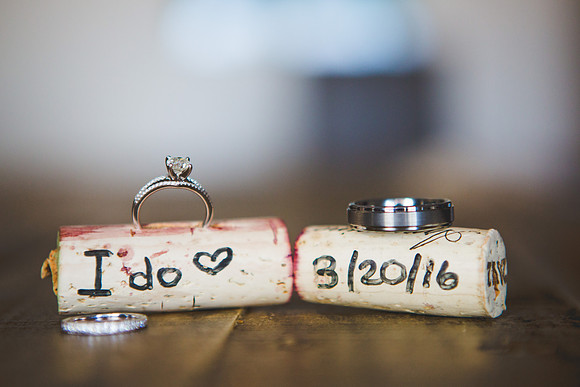 Wedding rings in wine corks with wedding date on them